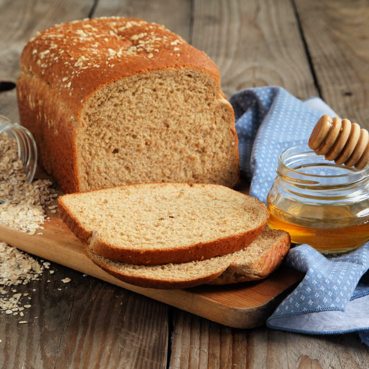https://www.wildernesswife.com/wp-content/uploads/2023/08/honey_oatmeal_bread_with_ingredients.jpg
